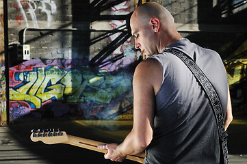 Image showing music guitar player outdoor 