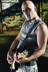 Image showing music guitar player outdoor 