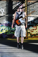 Image showing music guitar player outdoor 