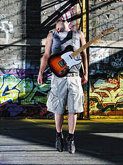 Image showing music guitar player outdoor 