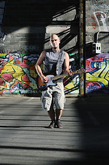 Image showing music guitar player outdoor 