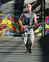 Image showing music guitar player outdoor 