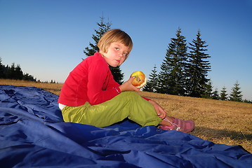 Image showing the girl eating apple in nature