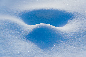 Image showing snow drifts last rays of the sun