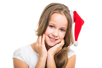 Image showing beautiful girl with red Christmas cap on isolated white