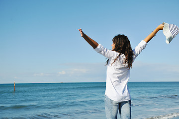 Image showing happy young woman on beach