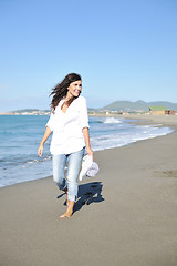 Image showing happy young woman on beach