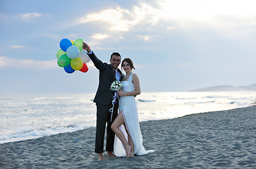 Image showing romantic beach wedding at sunset