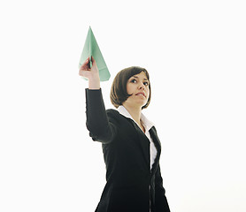 Image showing business woman throwing  paper airplane 