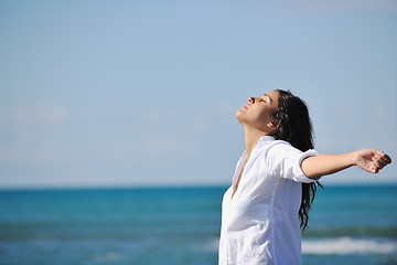 Image showing happy young woman on beach