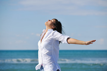 Image showing happy young woman on beach