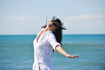 Image showing happy young woman on beach