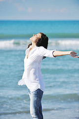 Image showing happy young woman on beach