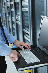 Image showing young it engeneer in datacenter server room