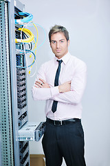 Image showing young it engeneer in datacenter server room