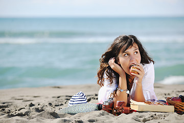 Image showing happy young woman on beach