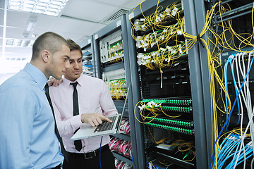 Image showing it engineers in network server room