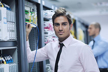 Image showing it engineers in network server room