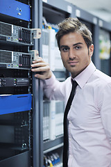 Image showing young it engineer in datacenter server room