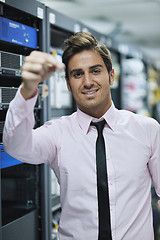 Image showing young it engineer in datacenter server room