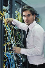 Image showing young it engineer in datacenter server room