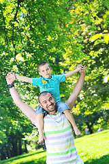 Image showing happy father and son have fun at park