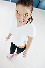 Image showing happy diet concept with young woman on pink scale