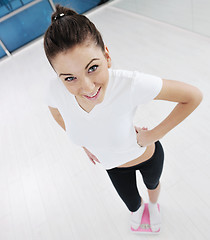 Image showing happy diet concept with young woman on pink scale