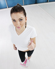 Image showing happy diet concept with young woman on pink scale