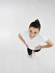 Image showing happy diet concept with young woman on pink scale