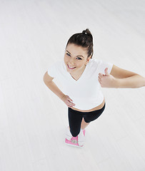 Image showing happy diet concept with young woman on pink scale