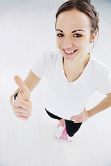 Image showing happy diet concept with young woman on pink scale