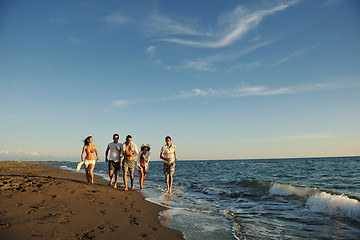 Image showing people group running on the beach