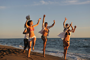 Image showing people group running on the beach