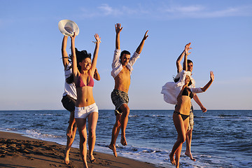 Image showing people group running on the beach