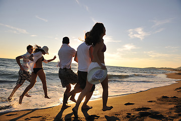 Image showing people group running on the beach