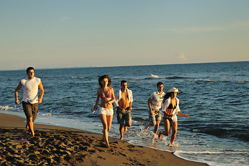 Image showing people group running on the beach