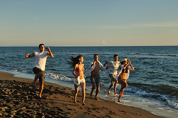 Image showing people group running on the beach