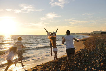 Image showing people group running on the beach