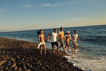 Image showing people group running on the beach