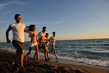 Image showing people group running on the beach