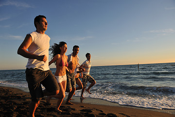 Image showing people group running on the beach