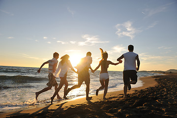 Image showing people group running on the beach