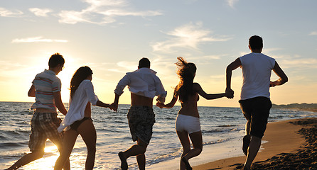 Image showing people group running on the beach