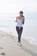 Image showing woman running on beach