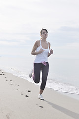 Image showing woman running on beach