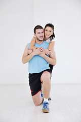 Image showing happy young couple fitness workout and fun