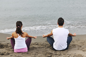 Image showing couple yoga beach