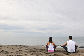 Image showing couple yoga beach