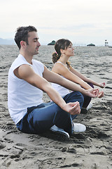 Image showing couple yoga beach